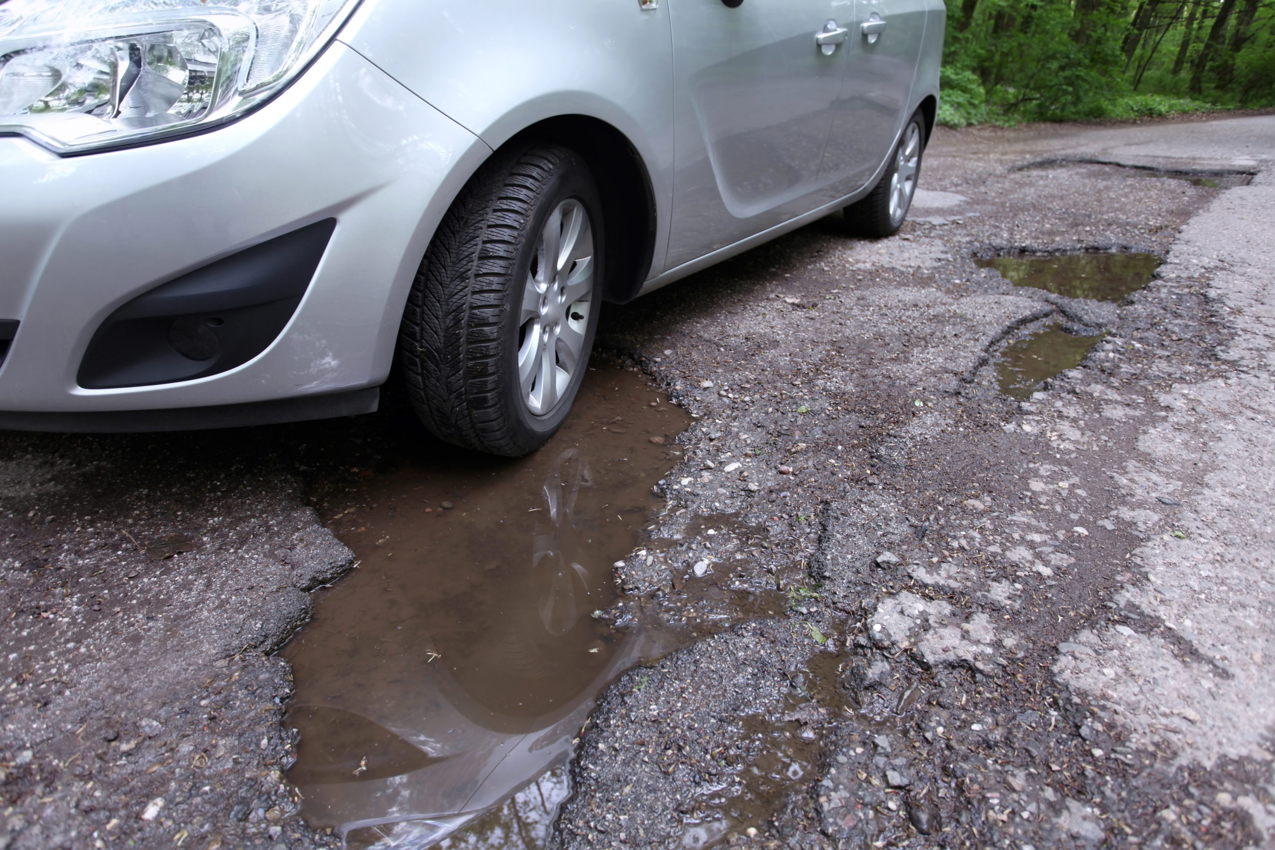 driving over potholes