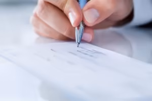 photo of a check being signed